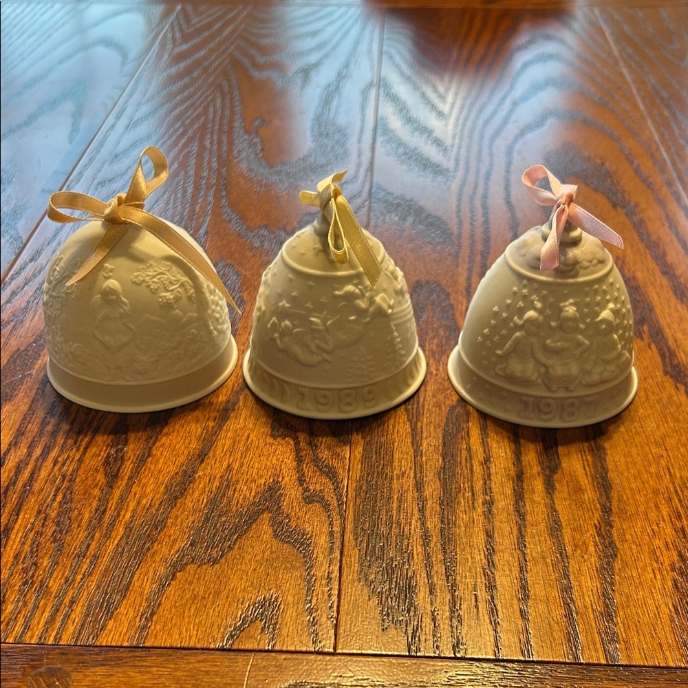 Set of Three Lladro porcelain Decorative Bells with ribbon bows